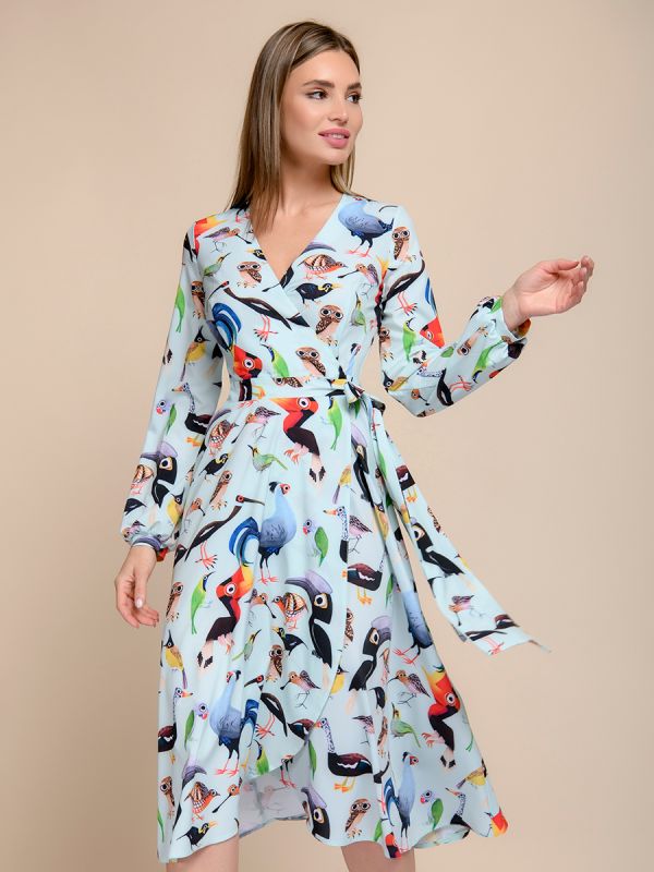 Mint-colored midi length printed dress with a flare and long sleeves