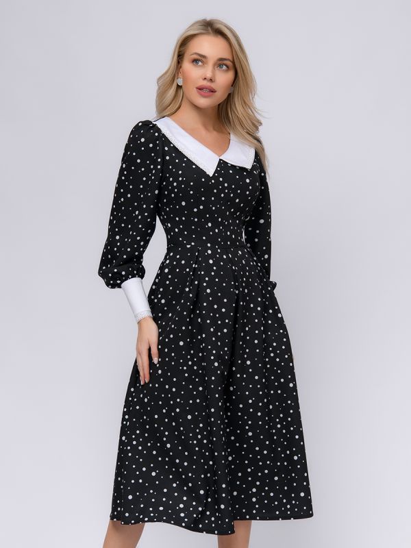 Black polka dot dress with white cuffs and collar