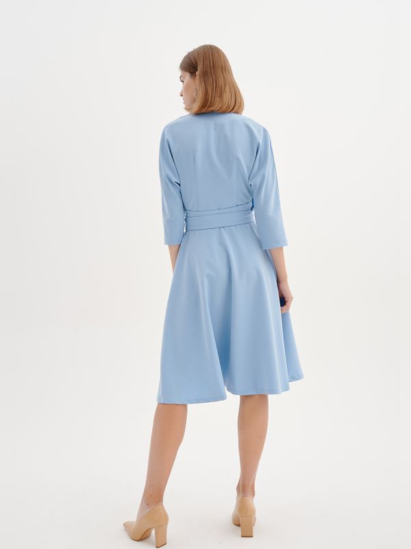 Midi length blue dress with 3/4 sleeves and flap