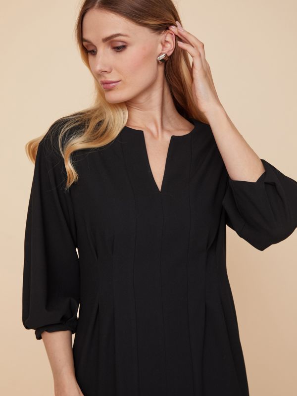 Black mini length dress with voluminous sleeves and pockets