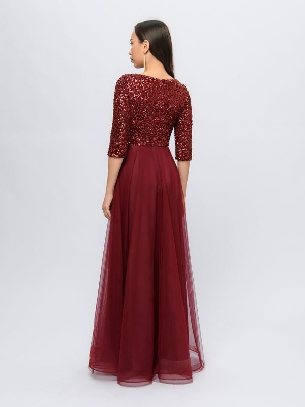 Wine colored maxi length dress with deep neckline and puffy skirt