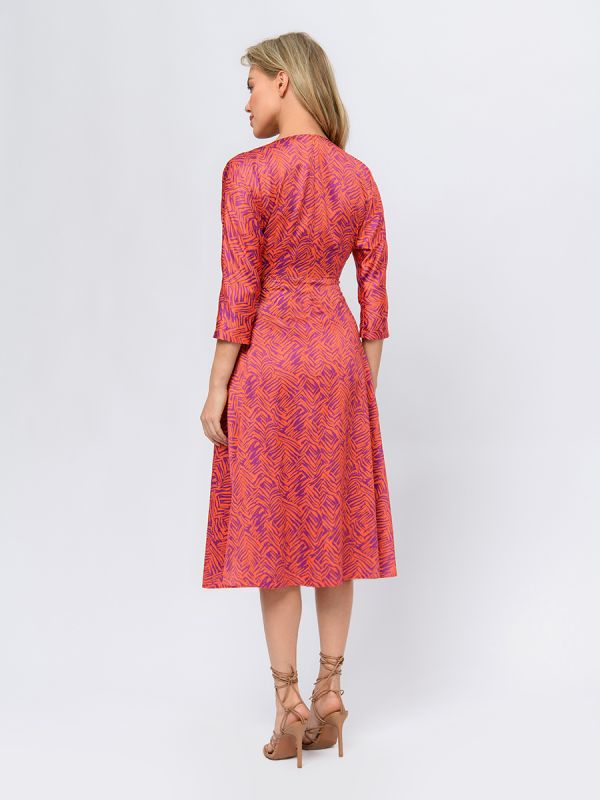 Orange colored midi length dress with print and V-neckline