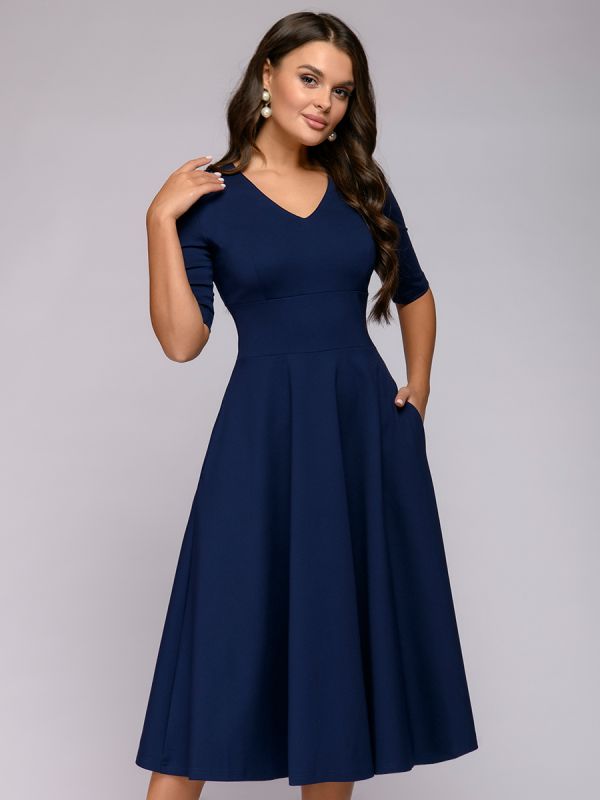 Blue midi length dress with deep neckline and 1/2 sleeves