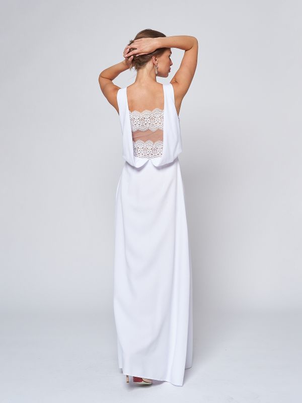 Sleeveless white maxi length dress with lace inset on back