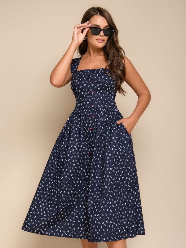 Dark blue midi length dress with strappy print