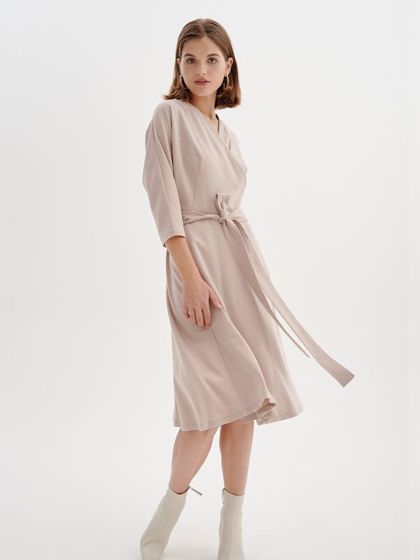 Beige midi length dress with stocking and 3/4 sleeves