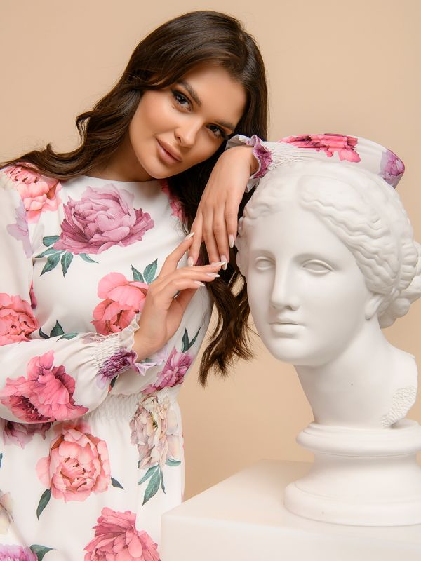 White dress with floral print and long sleeves