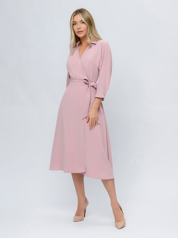 Pink colored midi length dress with a flare and 3/4 sleeves