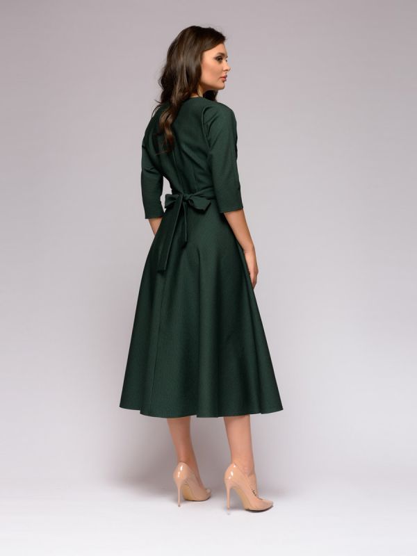 Emerald-colored midi length dress with batwing sleeves