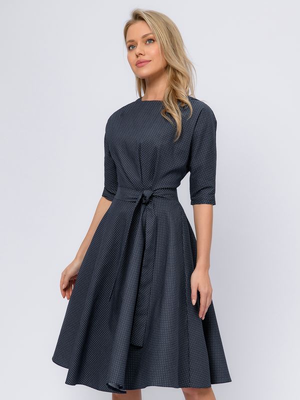 Midi length navy blue polka dot dress with waist flaps