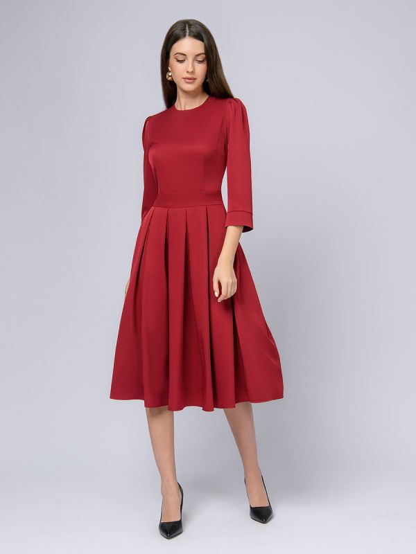 Burgundy colored midi length dress with 3/4 sleeves