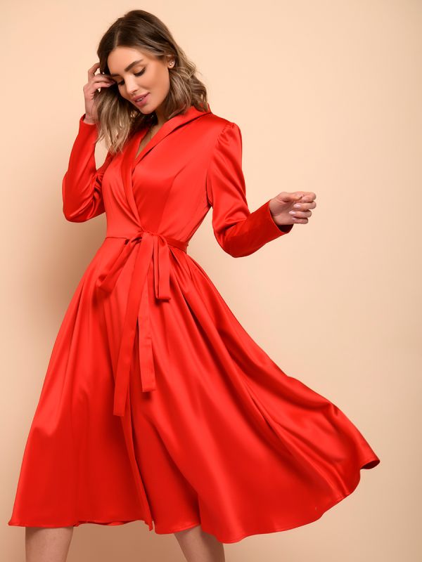 Red midi length dress with voluminous shoulders and long sleeves