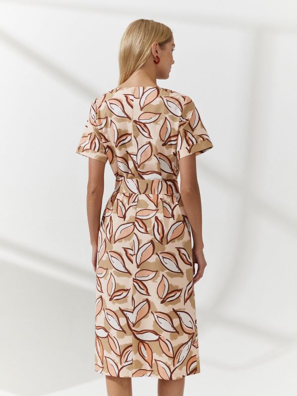 Peach colored dress with midi length print and waistband