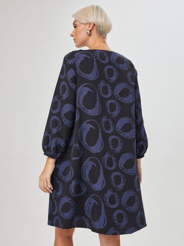 Mini length black print dress with lantern sleeves