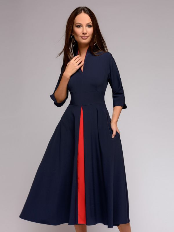 Dark blue midi length dress with red inset and 3/4 sleeves