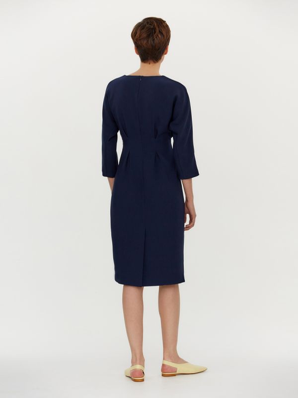 Dark blue dress with pleats at waist and batwing sleeves