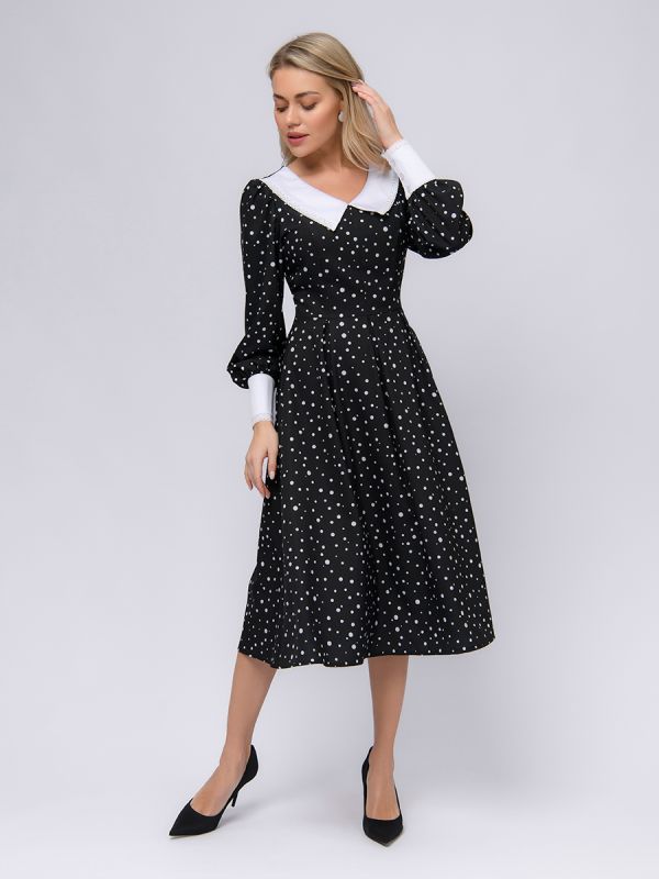 Black polka dot dress with white cuffs and collar