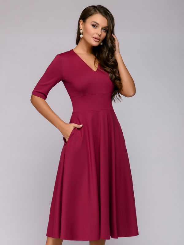 Midi length burgundy dress with deep neckline and 1/2 sleeves