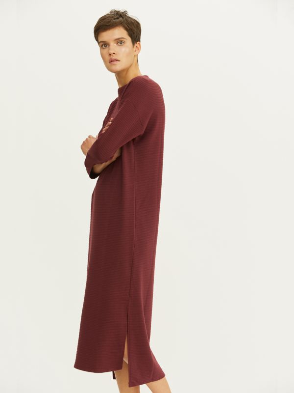 Midi length burgundy dress with 3/4 sleeves and slits on the sides