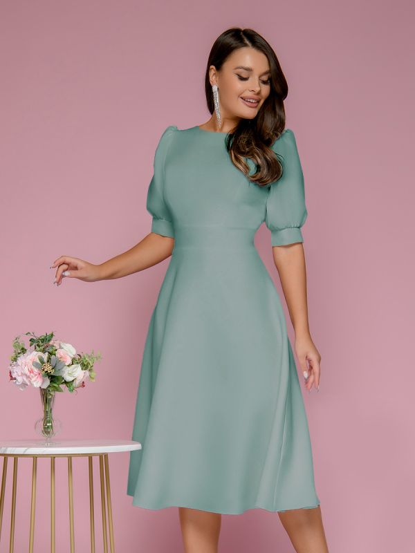 Mint colored midi length dress with shaped back neckline