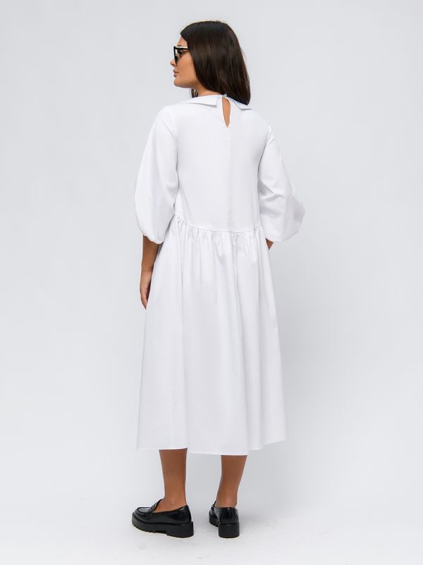 White dress with puffed sleeves and high waist