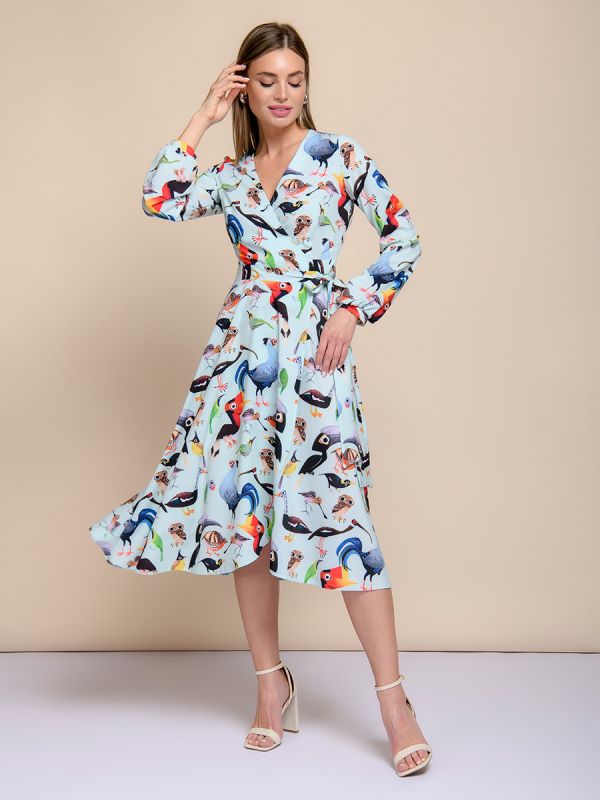 Mint-colored midi length printed dress with a flare and long sleeves