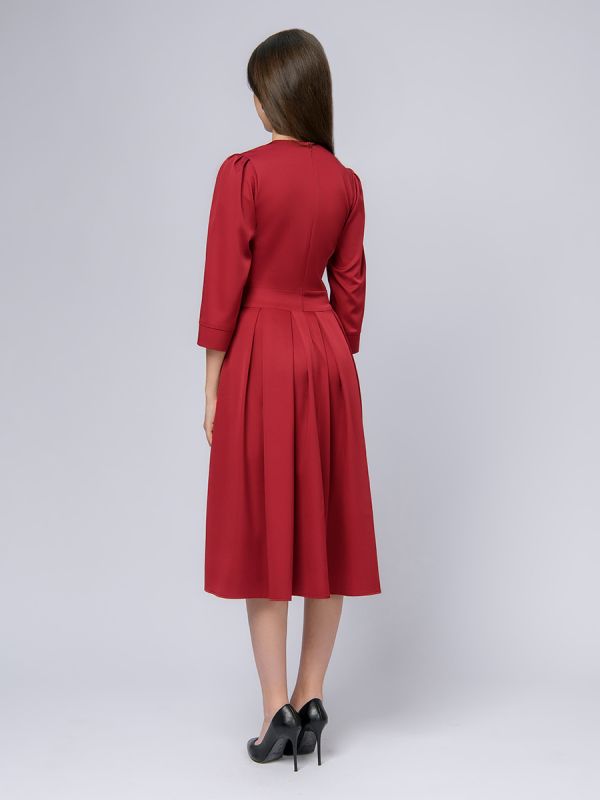 Burgundy colored midi length dress with 3/4 sleeves