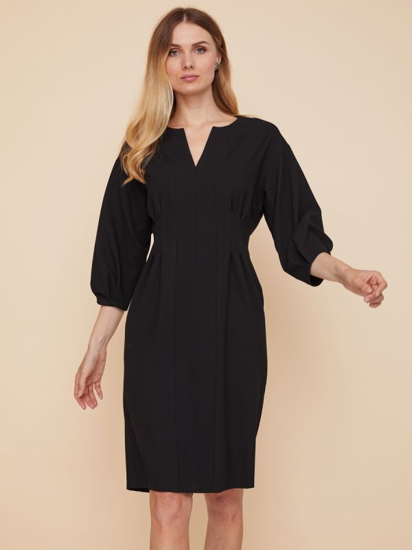 Black mini length dress with voluminous sleeves and pockets