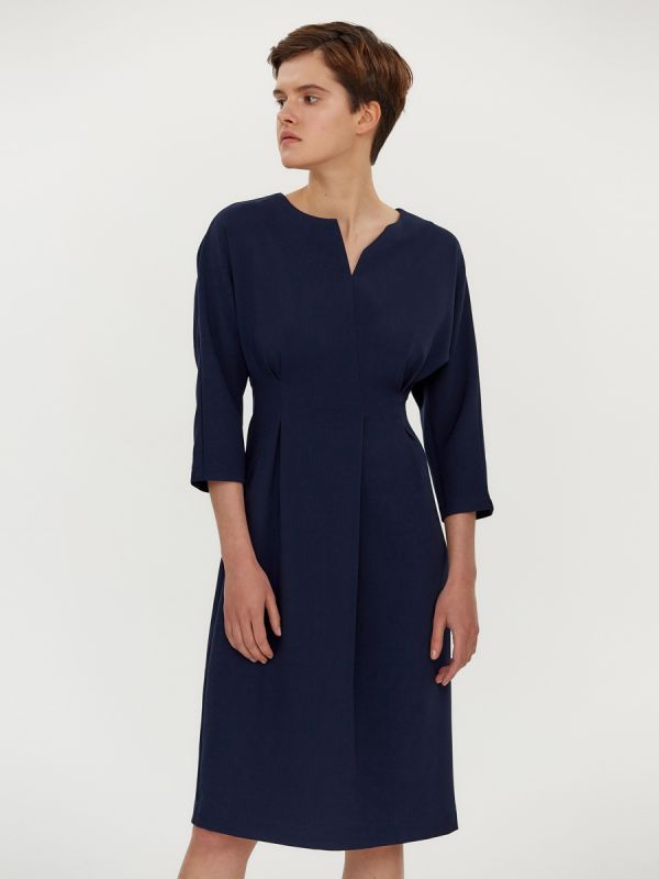 Dark blue dress with pleats at waist and batwing sleeves