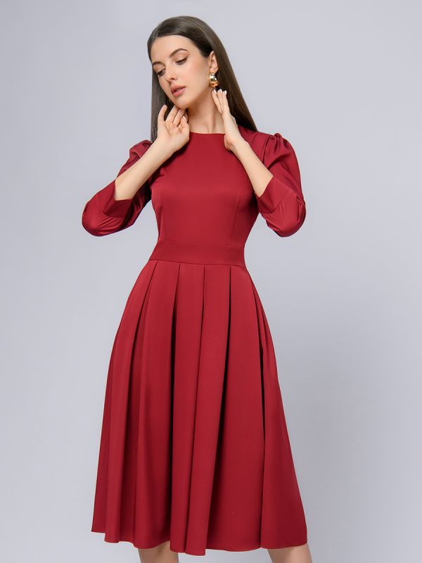 Burgundy colored midi length dress with 3/4 sleeves