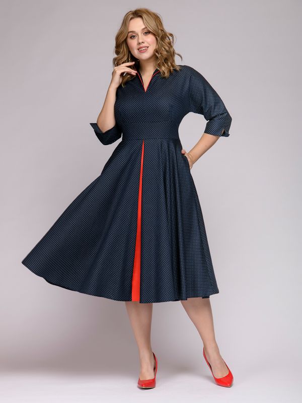 Midi length navy blue polka dot dress with red inset