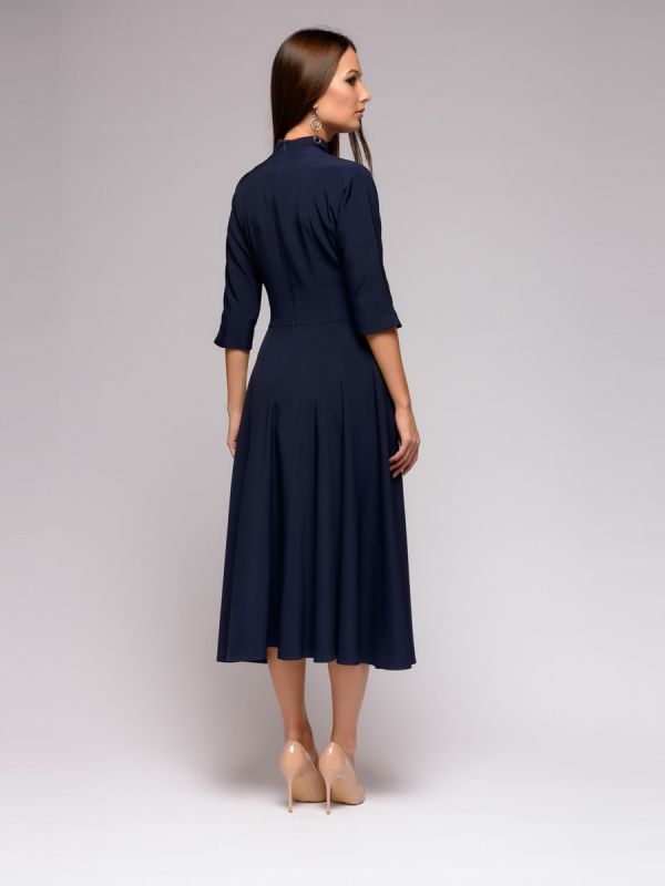 Dark blue midi length dress with red inset and 3/4 sleeves