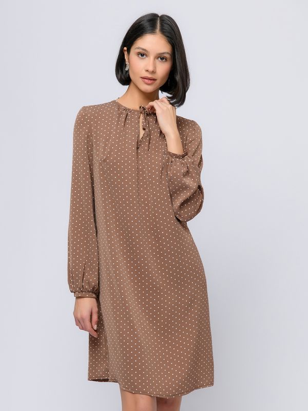 Light brown polka dot mini length dress with a bow