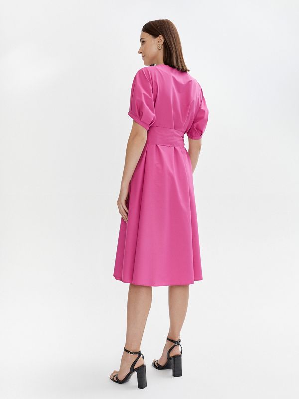 Fuchsia colored midi length dress with voluminous sleeves and a belt