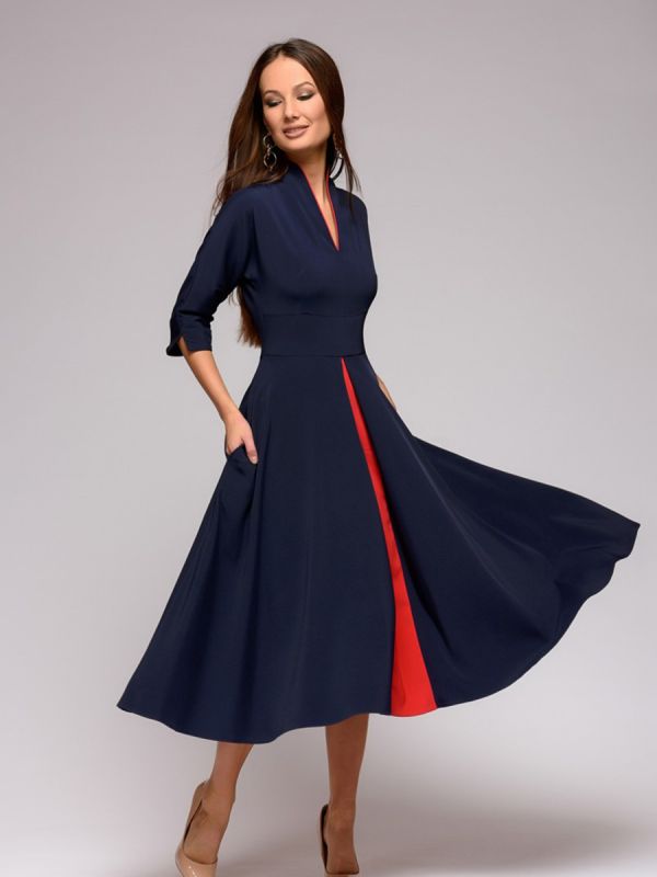 Dark blue midi length dress with red inset and 3/4 sleeves