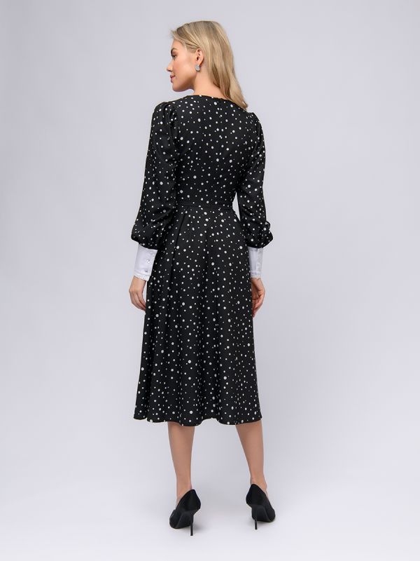 Black polka dot dress with white cuffs and collar