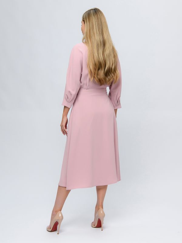 Pink colored midi length dress with a flare and 3/4 sleeves