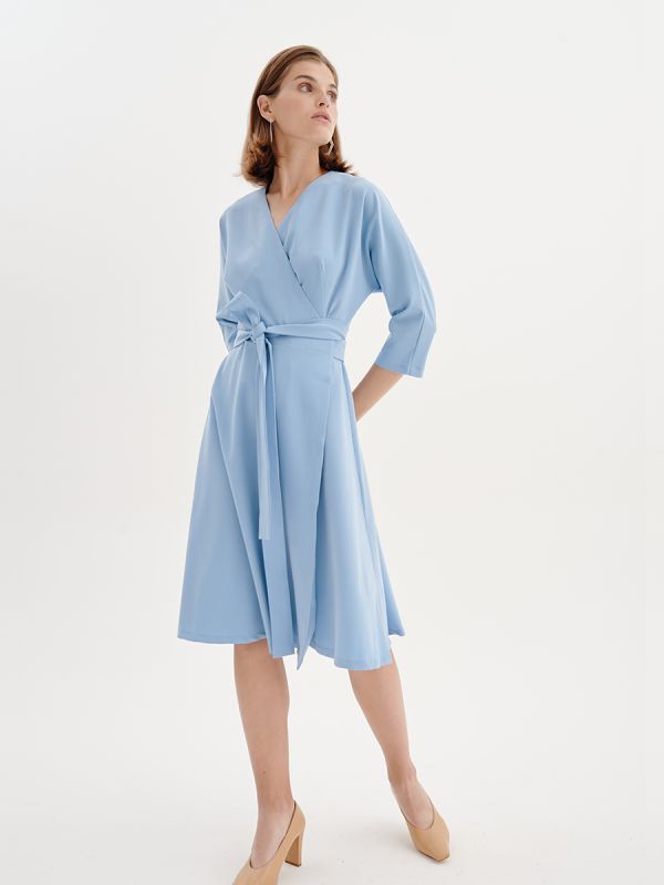 Midi length blue dress with 3/4 sleeves and flap