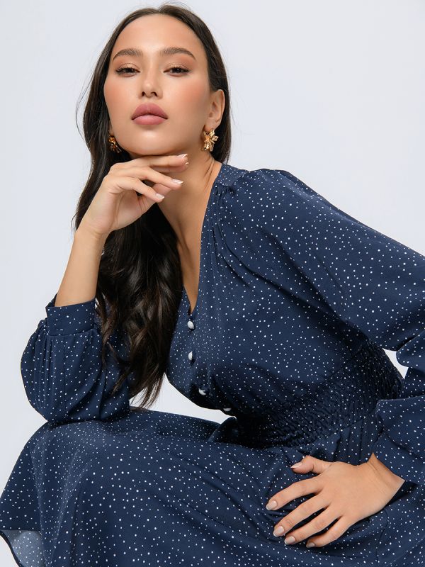 Blue polka dot midi length dress with wide elastic band at the waist