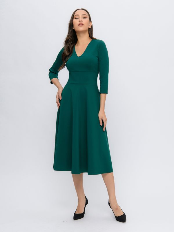 Emerald color midi length dress with deep neckline and 3/4 sleeves