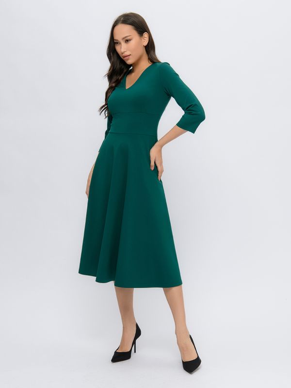 Emerald color midi length dress with deep neckline and 3/4 sleeves