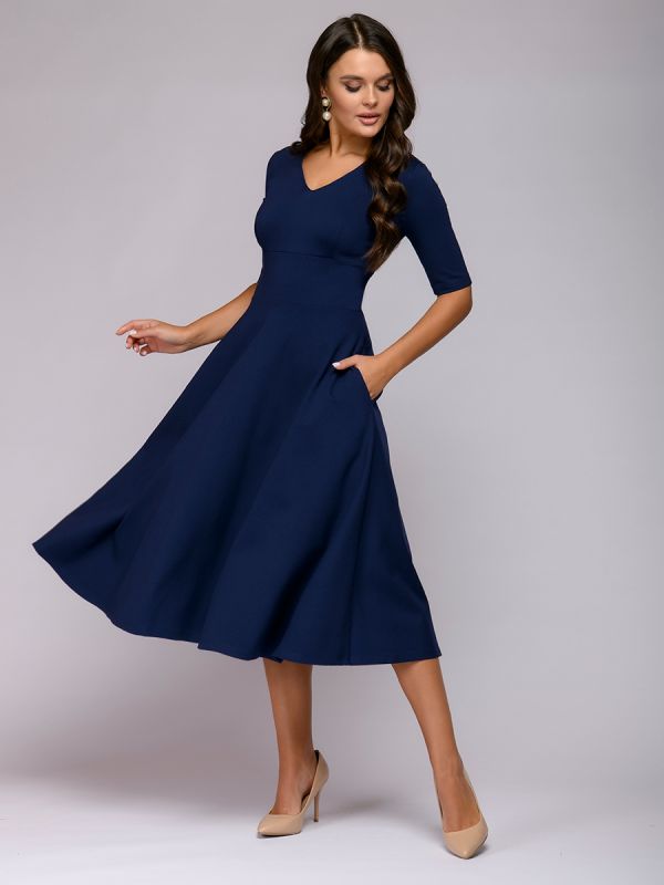 Blue midi length dress with deep neckline and 1/2 sleeves