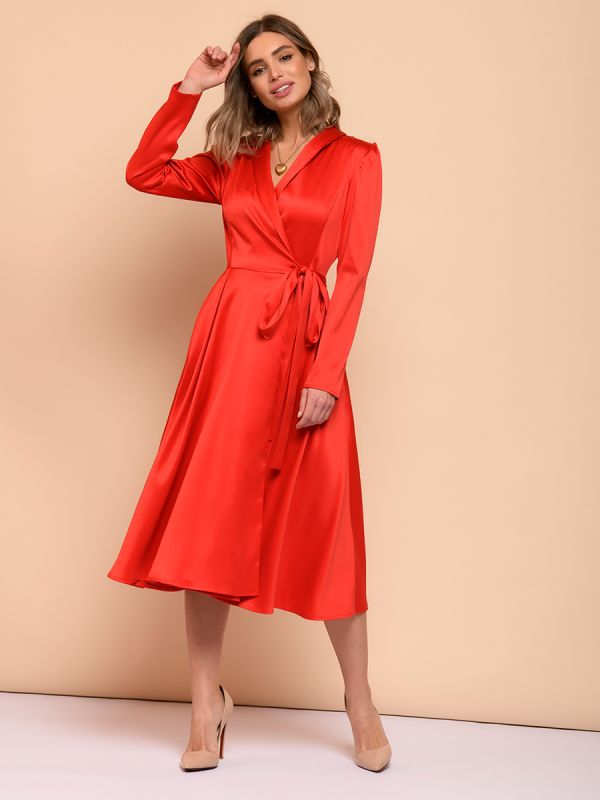 Red midi length dress with voluminous shoulders and long sleeves