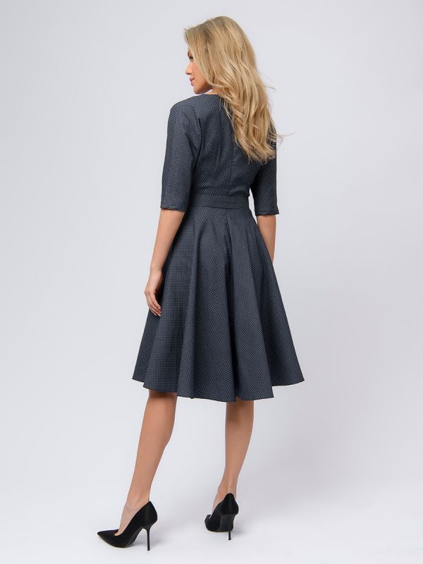 Midi length navy blue polka dot dress with waist flaps