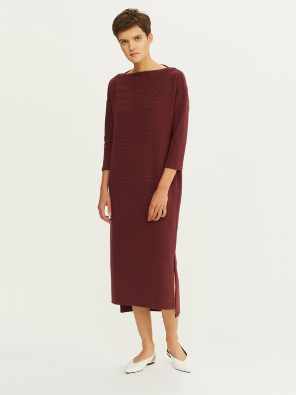 Midi length burgundy dress with 3/4 sleeves and slits on the sides