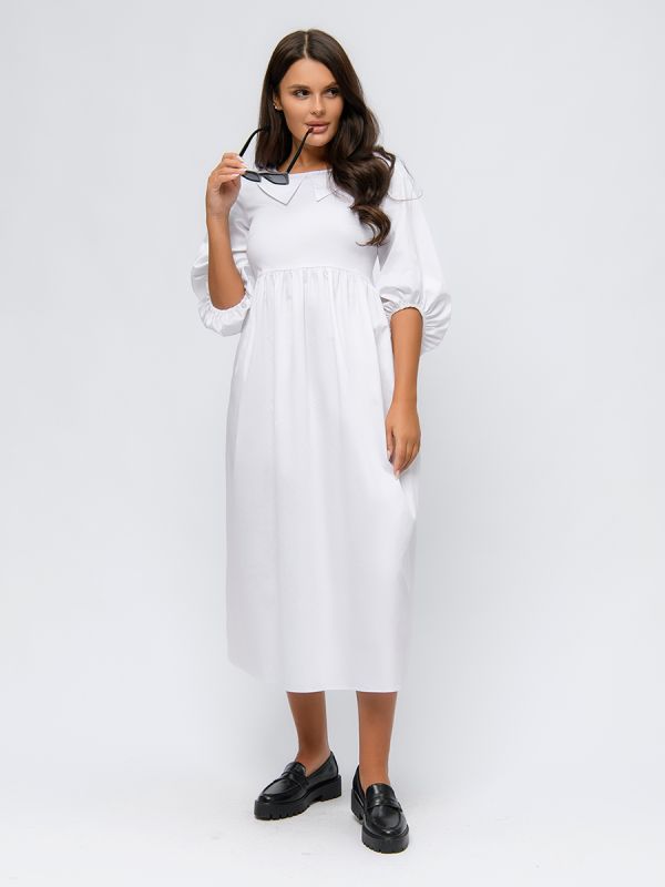 White dress with puffed sleeves and high waist