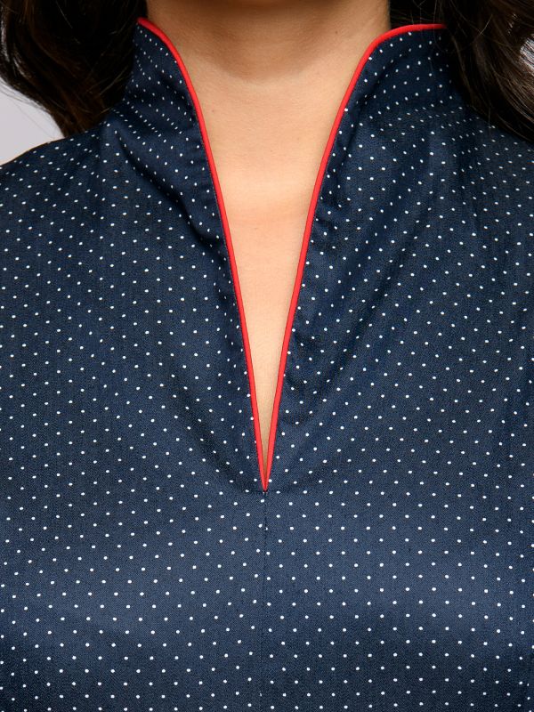 Midi length navy blue polka dot dress with red inset