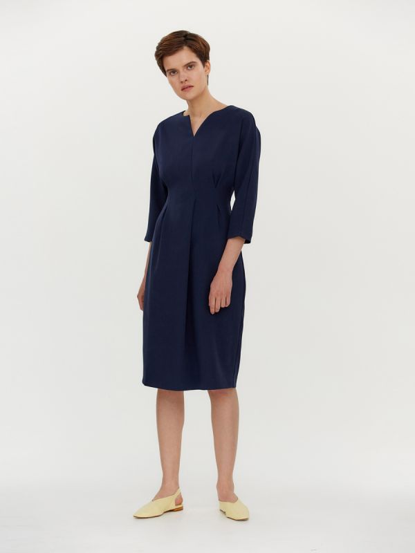 Dark blue dress with pleats at waist and batwing sleeves