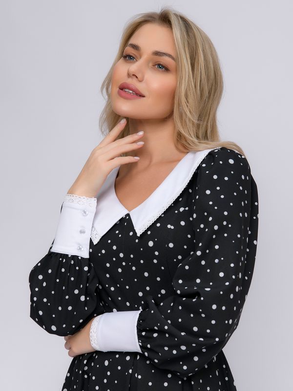 Black polka dot dress with white cuffs and collar