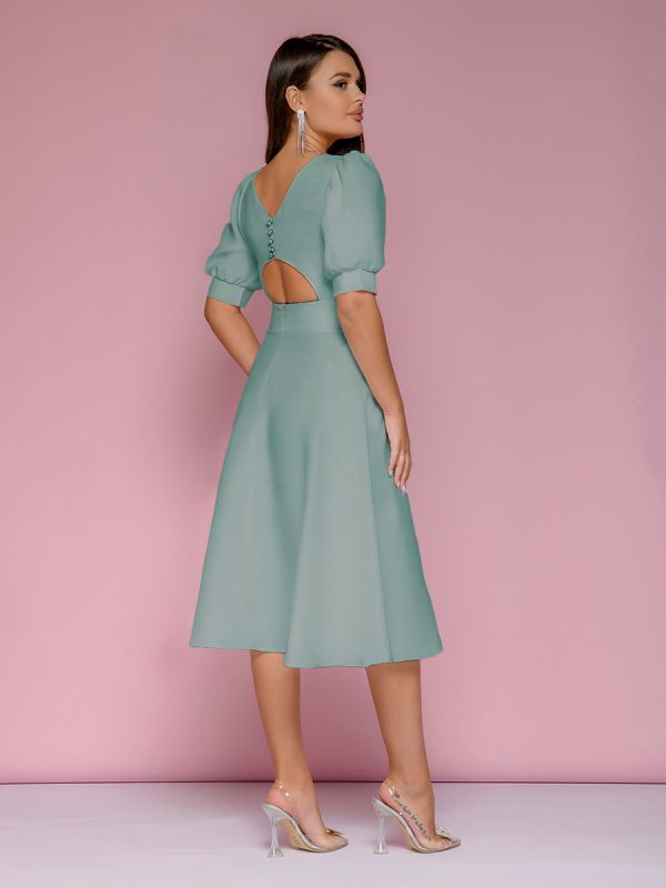 Mint colored midi length dress with shaped back neckline